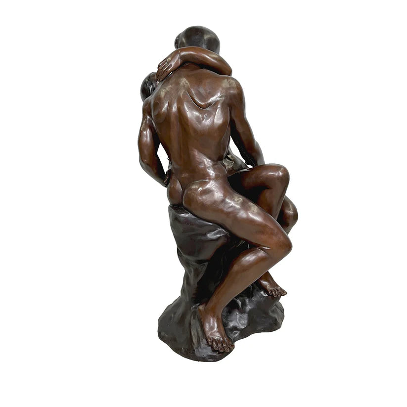 Bronze sculpture of two figures embracing on a white background by Rodin Replica