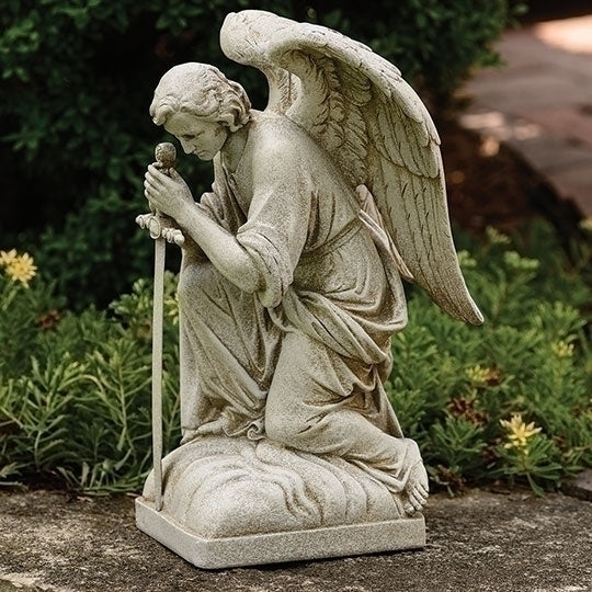 Kneeling Male with Sword Statue of an angel in a garden setting