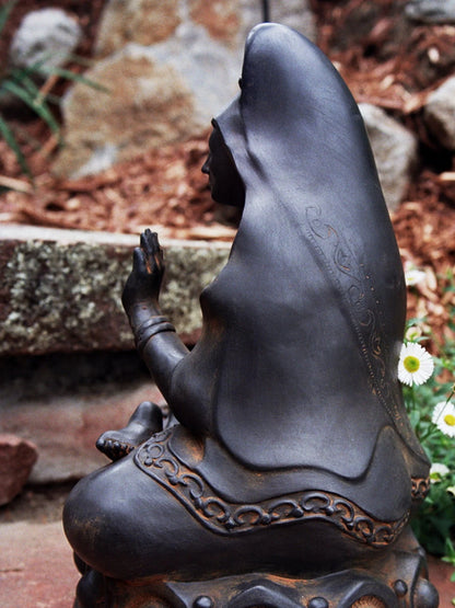 Side view Kuan Yin statue by Sigrid Herr Guanyin goddess of mercy sculpture Buddhist deity