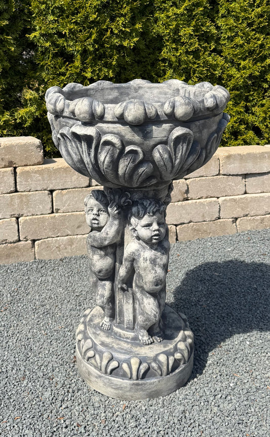 three cherubs supporting planter bowl Renaissance style flower urn