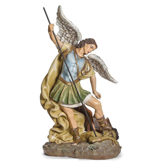 Large Saint Michael religious statue with wings and spear