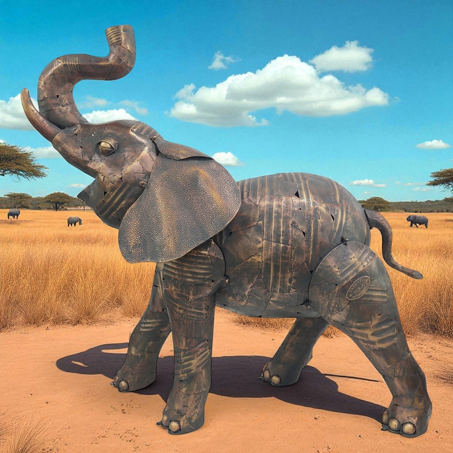 Life-size iron elephant statue with raised trunk displayed outdoors