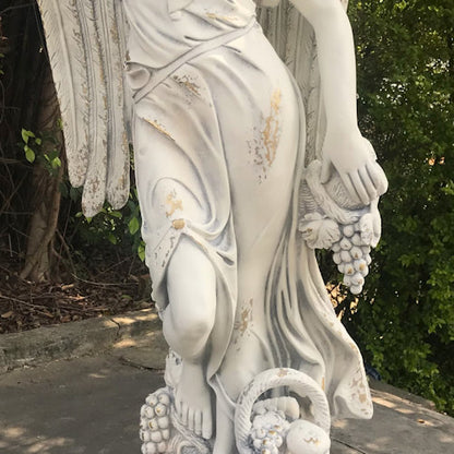 Close up Angel of the Harvest Life-Size Garden Sculpture with Grapes and Fruit Basket
