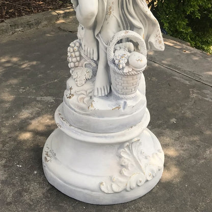 Shown on optional base Angel of the Harvest Life-Size Garden Sculpture with Grapes and Fruit Basket