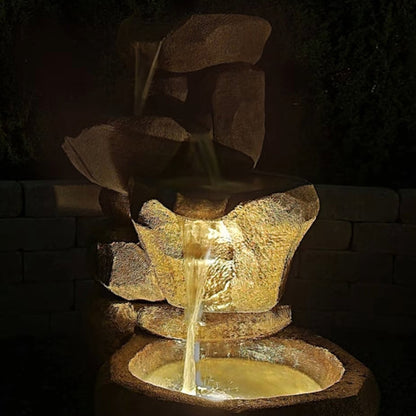 Flowing Canyon Fountain Cast Stone night time view of water feature cascading