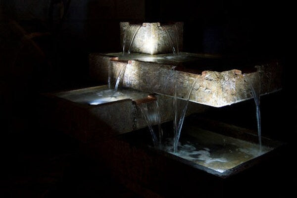 Lighted Bauhaus Fountain is three levels of modern cantilevered spills