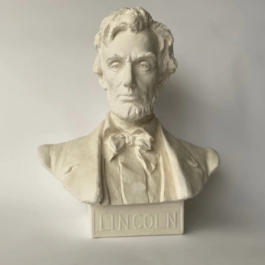 Bust of a historical figure with 'LINCOLN' inscribed below on a plain background