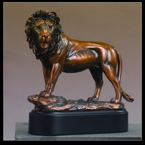Bronze lion statue with detailed mane and muscular body on black base