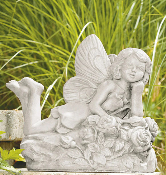 Laying rose fairy cast stone garden statue resting on sculpted roses made in USA