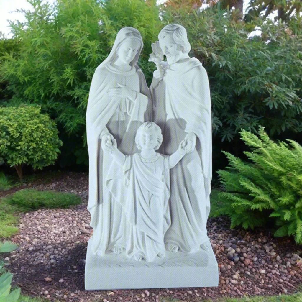 20-inch Sacred Family statue in white Italian marble, displayed outdoors in a garden setting with soft natural lighting