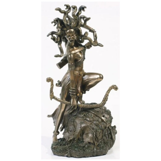 Bronze medusa sculpture, on a white background