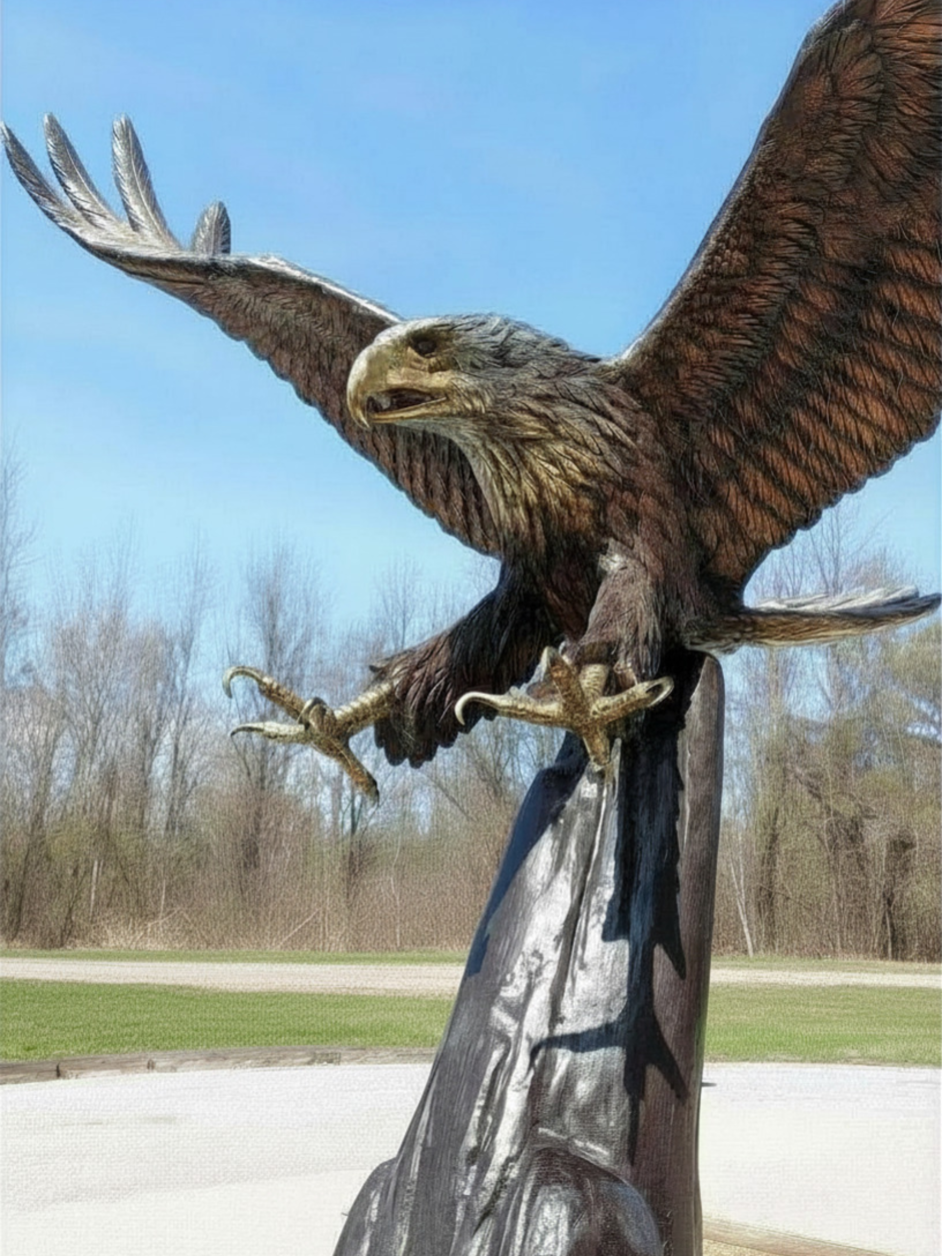 Monumental bronze eagle statue with wings fully spread