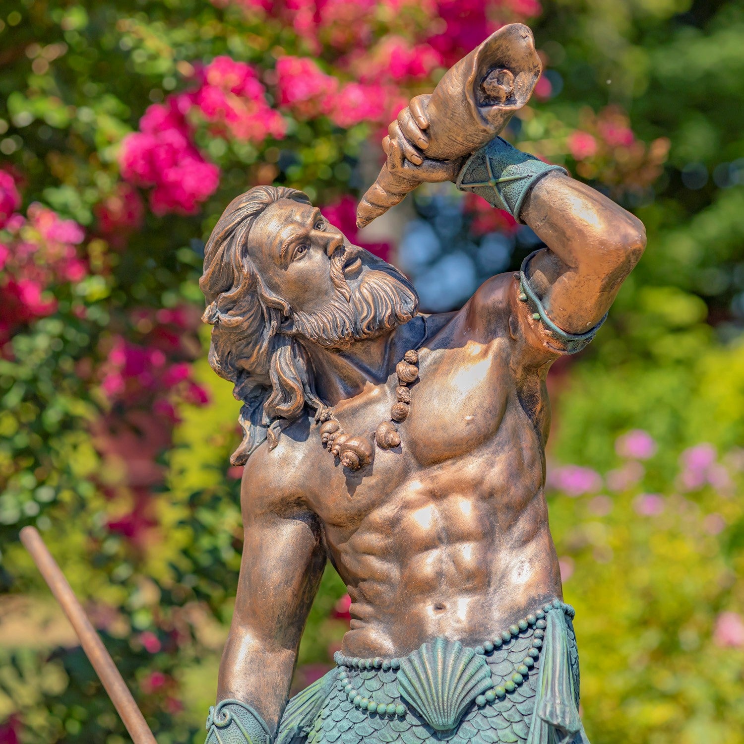 Neptune inspired sea god blowing shell with bronze and verde green finish