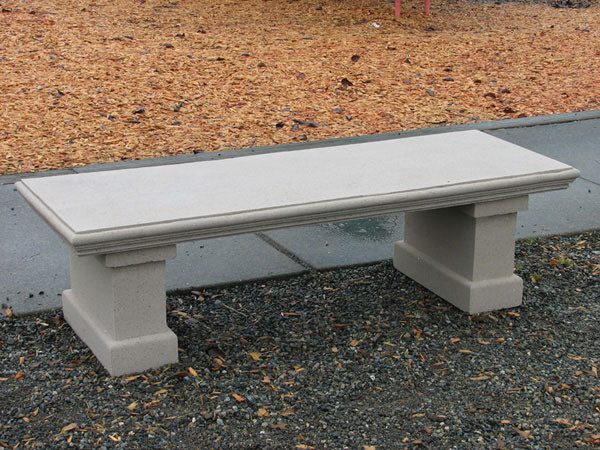 A light gray concrete outdoor bench with block-style legs American made Nisqually garden bench with color choice