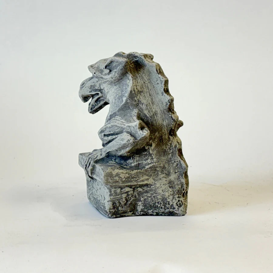 Stone gargoyle sculpture on a white background cornerstone statue