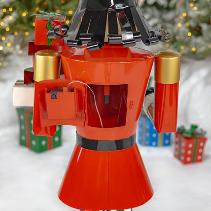 Nutcracker with Christmas Gifts Statue  shows how to install batteries