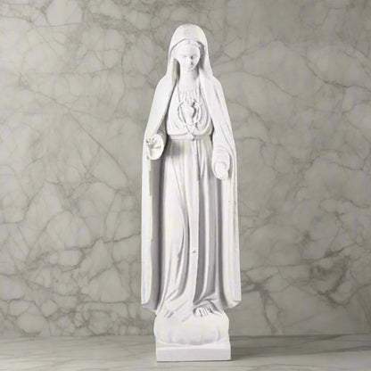 37.5-inch Italian marble Our Lady of Fatima statue, displayed in a landscaped prayer garden with flowers and soft natural surroundings