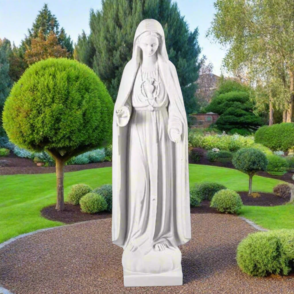 43.5-inch Our Lady of Lourdes statue in white Italian marble, displayed in a tranquil garden shrine with floral arrangements and greenery