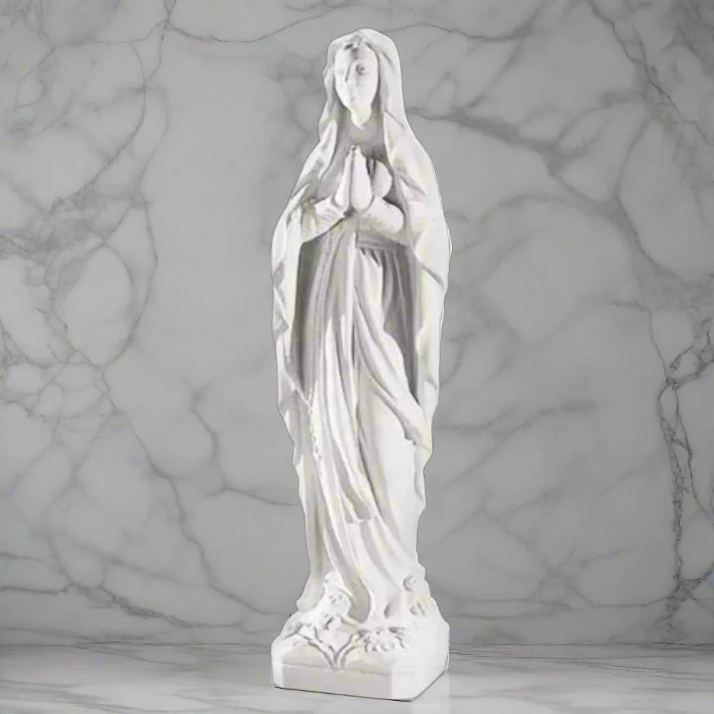 60.25-inch Italian marble Our Lady of Lourdes statue, placed in a beautifully landscaped garden shrine with surrounding flowers and stones