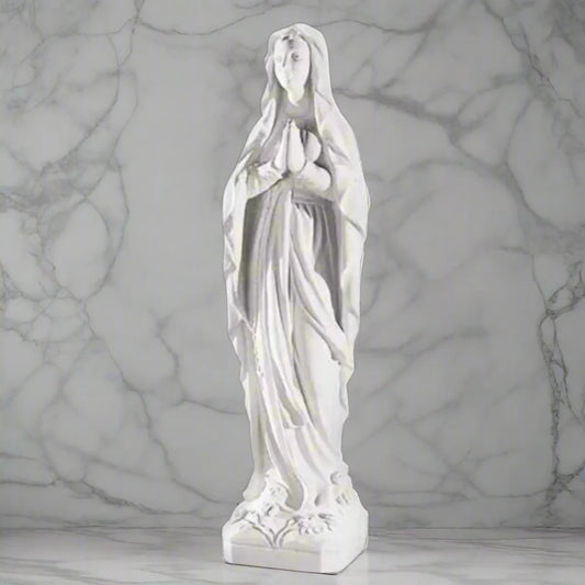 60.25-inch Italian marble Our Lady of Lourdes statue, placed in a beautifully landscaped garden shrine with surrounding flowers and stones