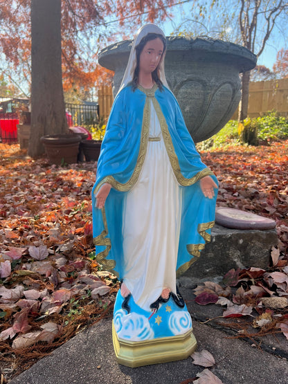 Catholic Our Lady of Grace statue standing in garden setting