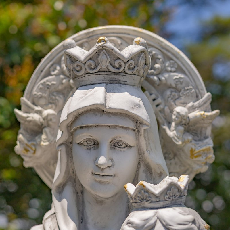 Statue of a woman with a crown and decorative elements against a blurred natural background Our Lady of Perpetual Help Statue – Antique Grey Religious Art