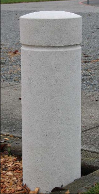 Heavy cast stone bollard for commercial landscape design for streetscapes and public spaces