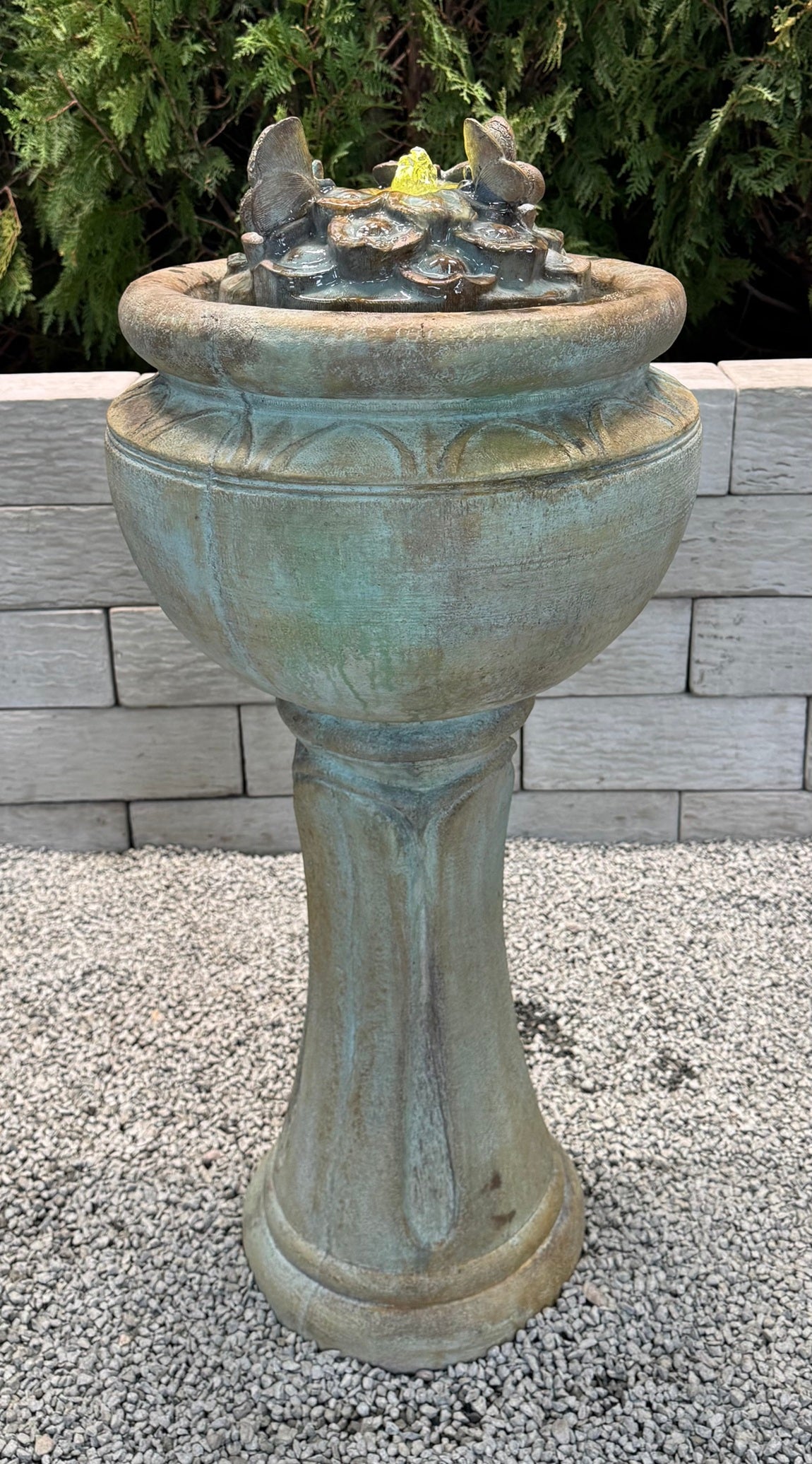 Pedestal butterfly fountain with shimmering nighttime glow tall on pedestal