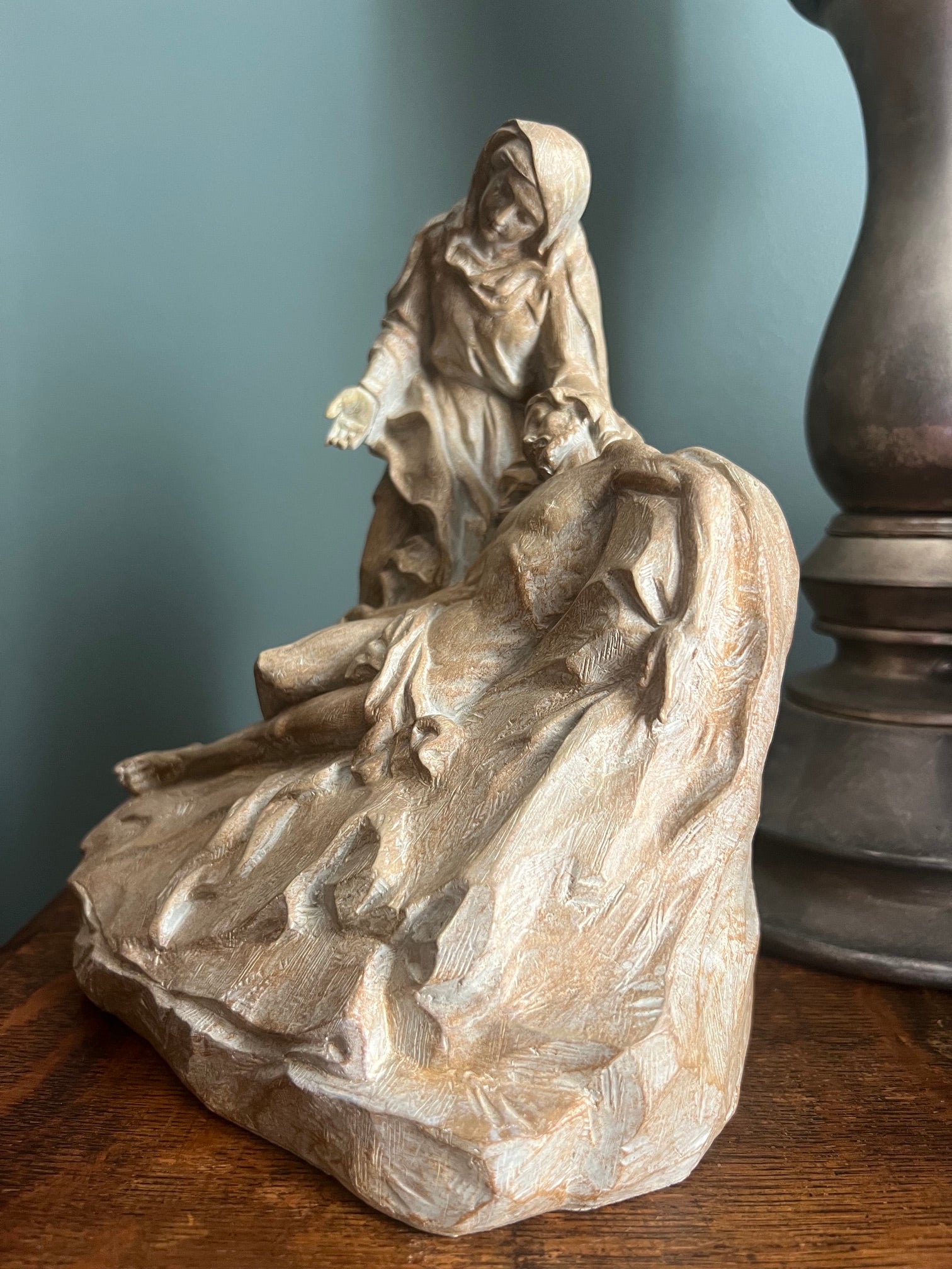 La Pietà religious sculpture of Mary mourning Jesus Christ side view