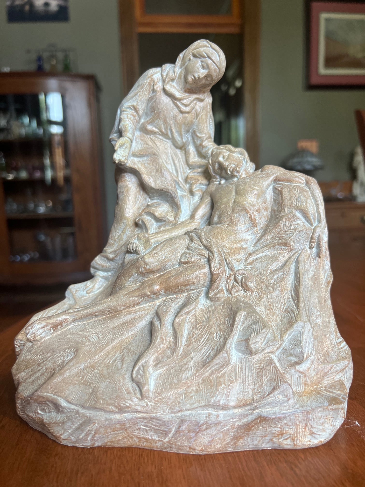 Catholic sculpture depicting Christ after the Crucifixion Mary grieving over Jesus devotional religious artwork