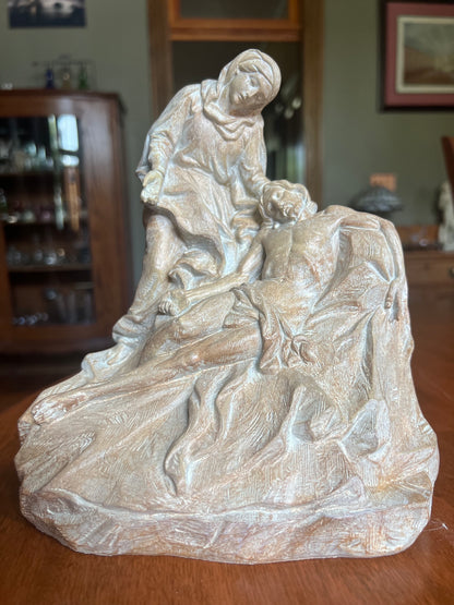 Catholic sculpture depicting Christ after the Crucifixion Mary grieving over Jesus devotional religious artwork