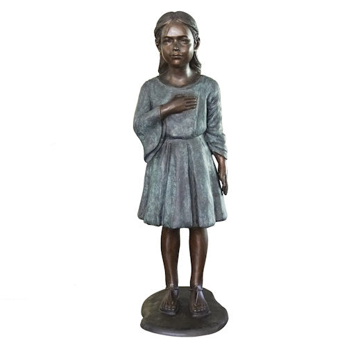 life-size bronze sculpture depicts a young girl standing with her hand placed respectfully over her heart as she proudly recites the Pledge of Allegiance to the flag of the United States of America