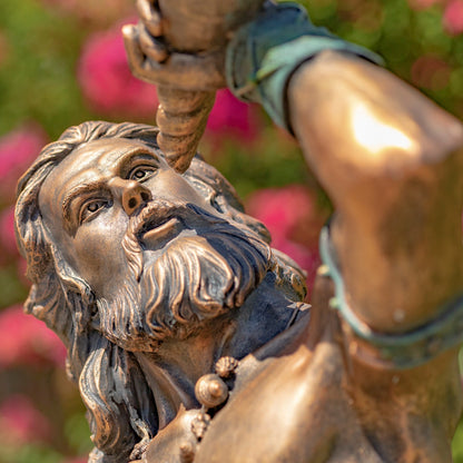 Close up of face Poseidon Neptune Sea God Merman Blowing Conch Shell Statue