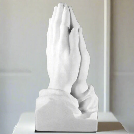 Authentic Italian marble Praying Hands statue, 47" tall, placed in a luxury spa-style interior with natural lighting and calming décor