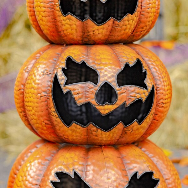 Close up of faces Pumpkins Jack-O-Lantern Totem Decoration