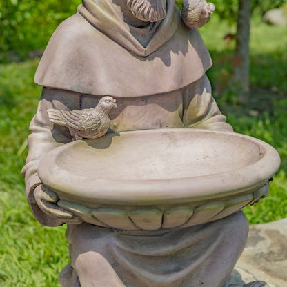 Close up of birdbath basin Sitting Saint Francis Statue holding surrounded by woodland animals in antique grey 