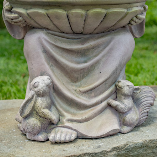 Close up of feet of sitting Saint Francis with rabbit and squirrel view