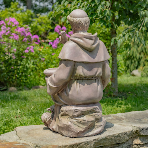 Back view Sitting Saint Francis Statue holding a birdbath surrounded by woodland animals