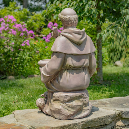 Back view Sitting Saint Francis Statue holding a birdbath surrounded by woodland animals