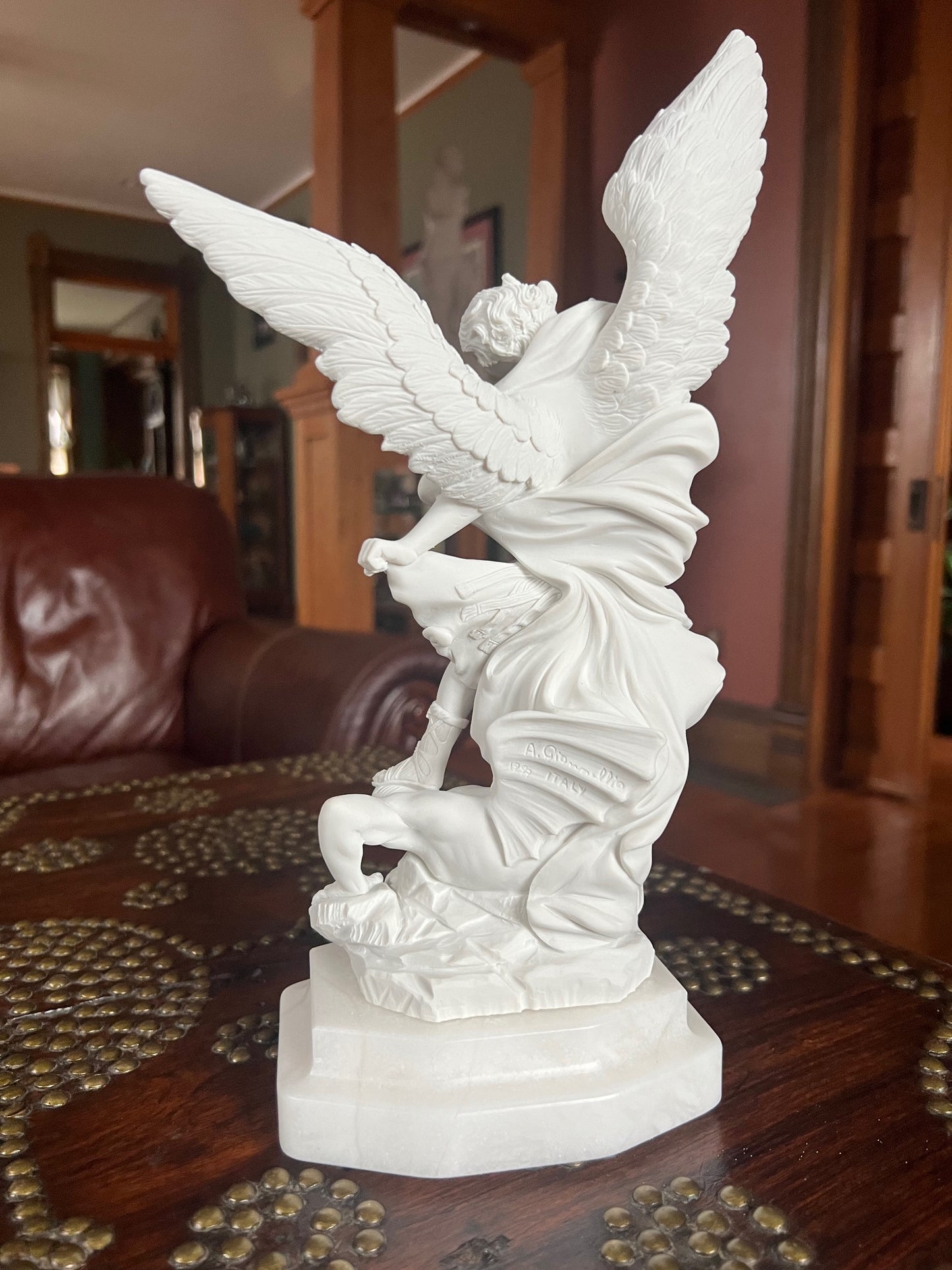Back view of sculpture Archangel Michael slaying Satan statue Guido Reni