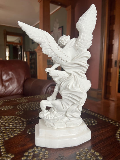 Back view of sculpture Archangel Michael slaying Satan statue Guido Reni