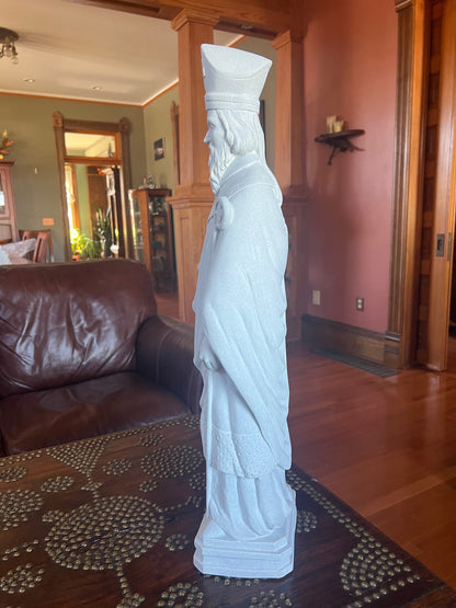 Side view Saint Patrick statue faux granite garden statue holding the symbolic shamrock