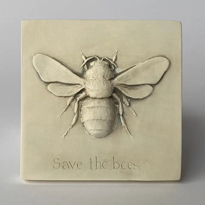 Decorative wall art with a bee design and 'Save the Bees' text on a beige background
