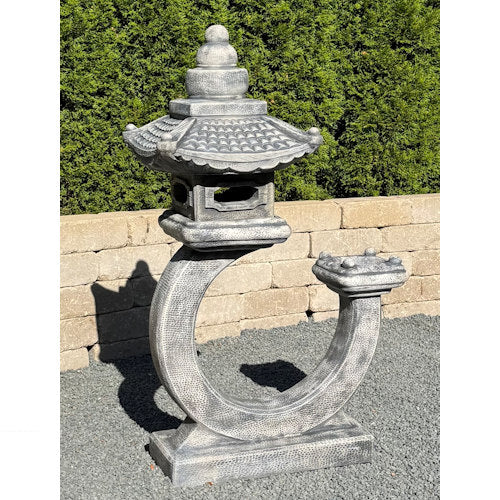 Curved pagoda lantern in cast stone with Asian-inspired design garden sculpture