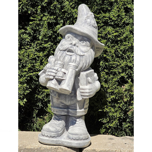 Garden gnome holding binoculars and bird identification book sculpture