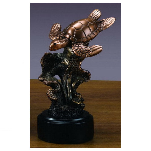 Bronze sea turtle sculpture swimming through sea grass on black base statue