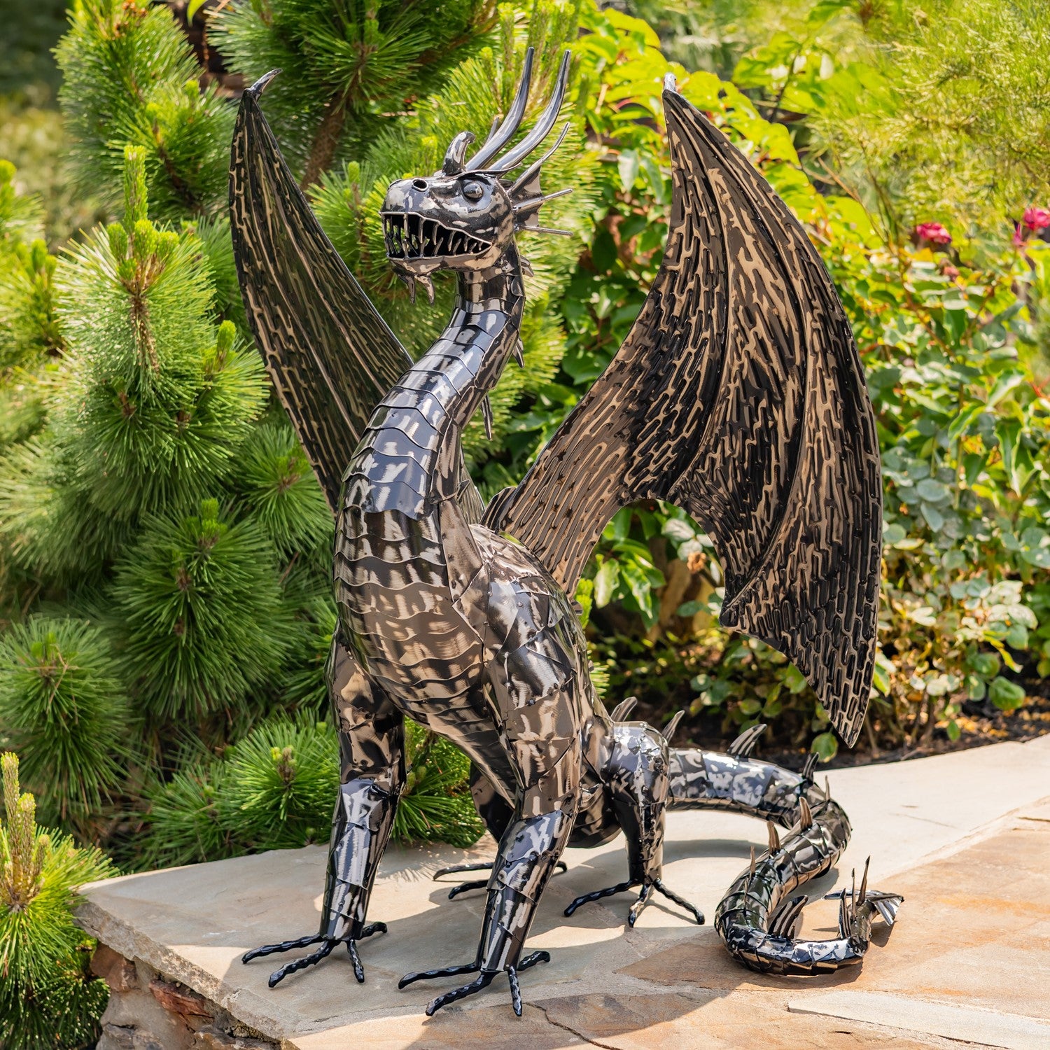 Metal dragon sculpture in a garden setting large scale statuary for outdoors