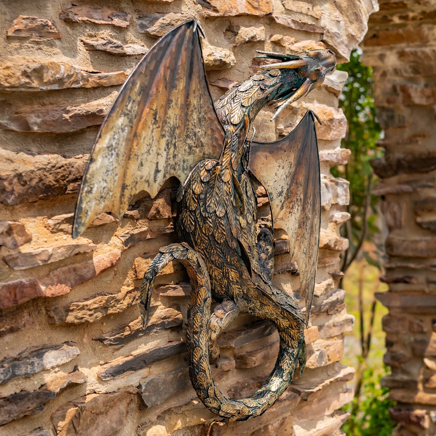 Side view of serpent Dragon sculpture on a stone wall frieze