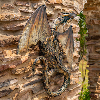 Side view of serpent Dragon sculpture on a stone wall frieze