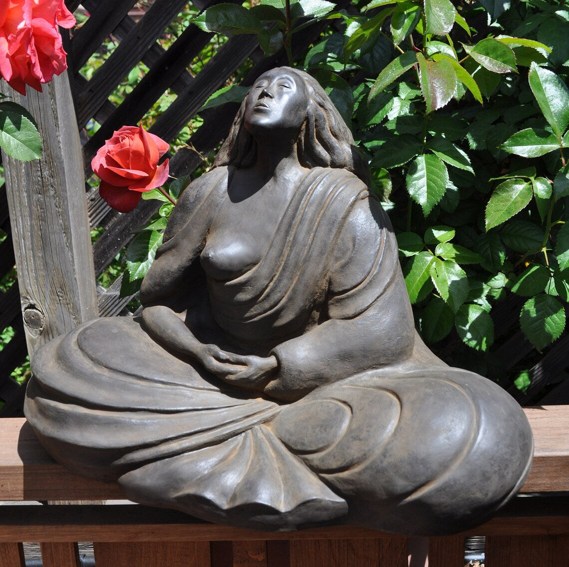 In sunshine Sigrid Herr small Western Buddha sculpture feminine art meditation statue